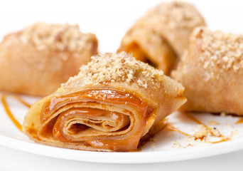 Rolled pancakes with caramel mousse