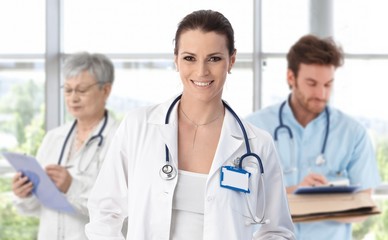 Medical team female doctor in front