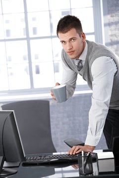 Young businessman working with computer