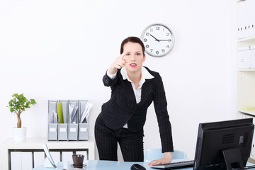 Businesswoman pushing abstract button.