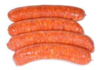 Salchichas rojas sobre fondo blanco.