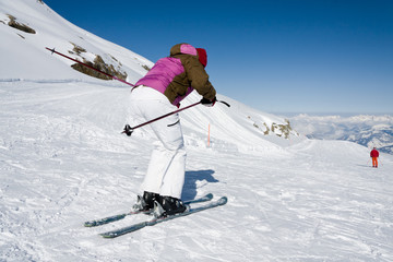 Woman downhill ski in apls