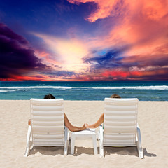 Honeymoon couple enjoy ocean sunset