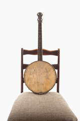 Antique Banjo On Antique Chair