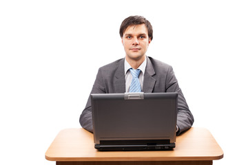 Young businessman with laptop at his desk