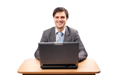 Young businessman with laptop at his desk