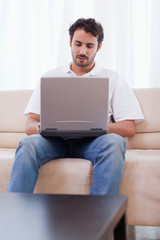 Portrait of a man using a laptop