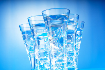 Water in the glass against gradient background