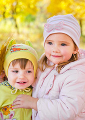 Little  girls in autumn park