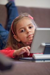Girl using a laptop for children
