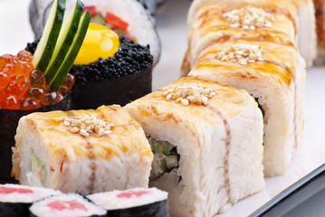 Closeup japanese sushi on a white plate. Sushi set