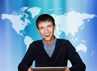 Portrait of handsome guy working with his tablet pc