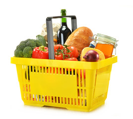 Shopping basket and groceries isolated on white