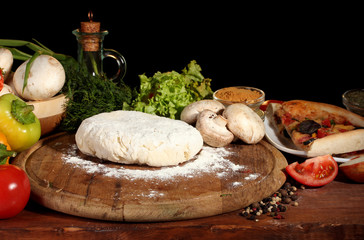 delicious pizza dough, spices and vegetables