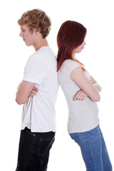 Angry couple standing back to back.