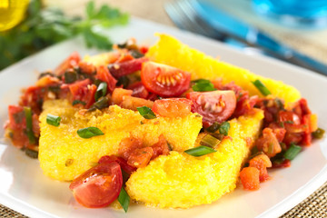 Polenta slices with Hogao, a Colombian salsa