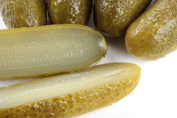 Pickled cucumbers on white background