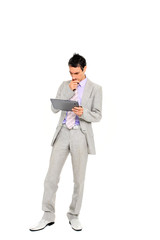 young business man standing using a tablet