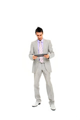 young business man standing using a tablet