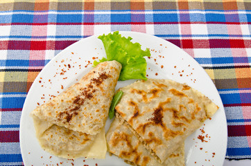 Herb stuffed pancaces in the plate