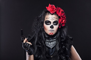 Serious woman in day of the dead mask portrait