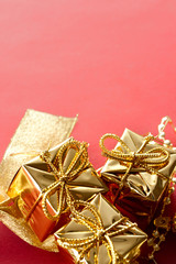 Gift boxes with bow on a red background
