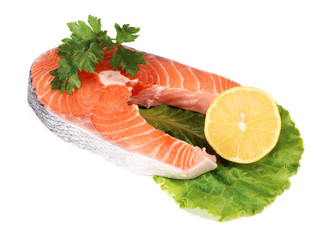 steaks of red fish with a lemon and parsley