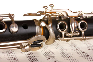 Obraz premium close up detail of clarinet and notebook with notes