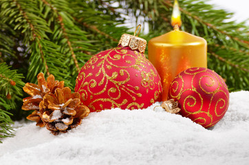 Fototapeta na wymiar Christmas balls and golden candle