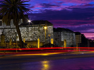 Old Havana at night withlight trails from passing cars
