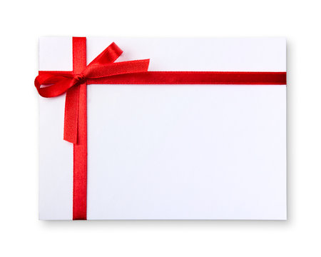 Blank gift tag tied with a bow of red satin ribbon