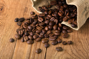 bag of coffee beans scattered on the table
