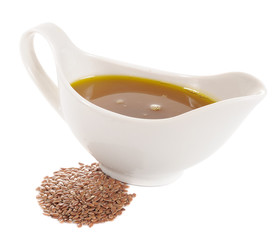 Flaxseed (Linseed) Oil and Flax Seeds on White Background
