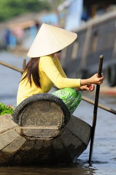 Woman on boat in Vietnam