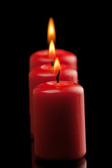 Fototapeta na wymiar three red candles