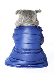 Child with pelt cap and worm winter coat hates the winter