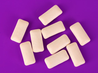 Chewing gums on purple background