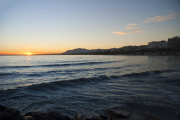 Sunset over beach at Marbella on Costa del Sol Spain