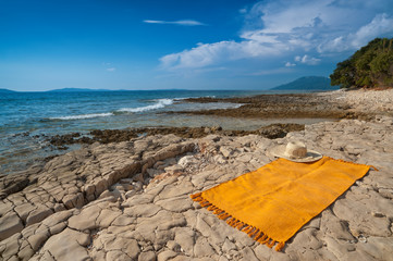 Wild Adriatic sea beach with rug for tanning. Croatia, Losinj - 37294034