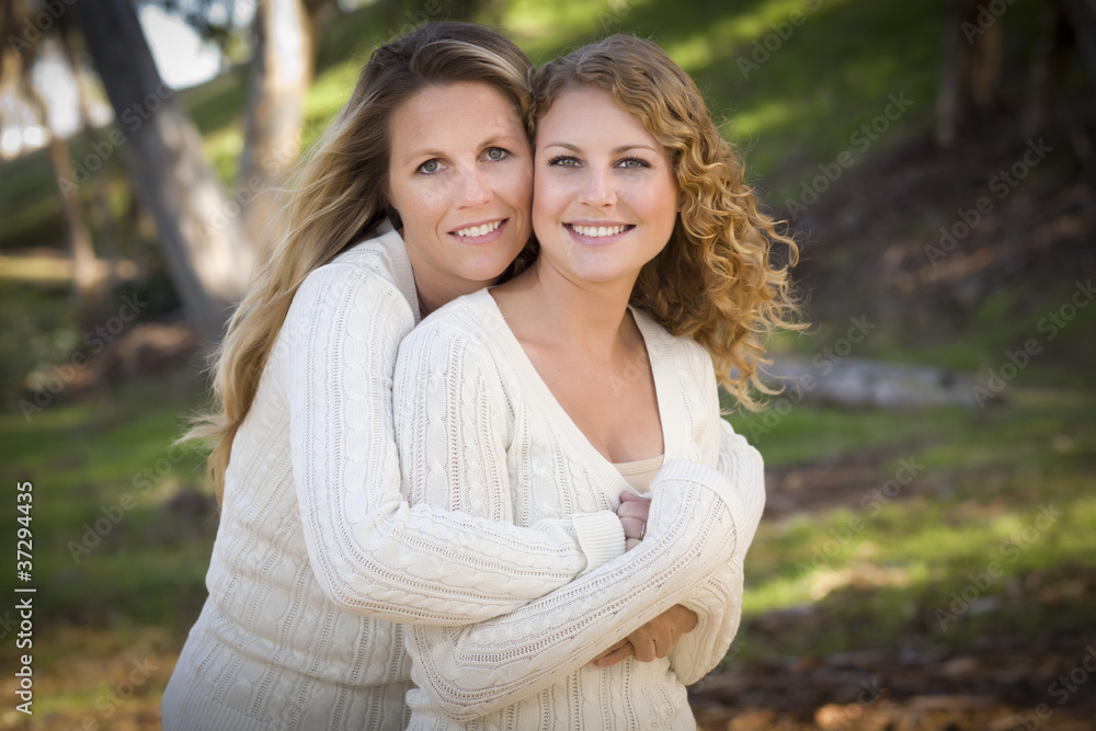 Wall mural Pretty Mother and Daughter Portrait in Park