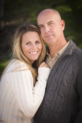 Attractive Couple Wearing Sweaters in Park
