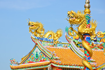 Fototapeta na wymiar Golden dragons in Chinese temple in Thailand