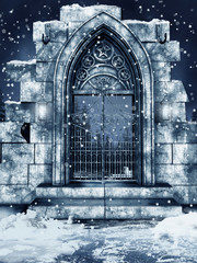 Ruiny cmentarnej bramy przykryte śniegiem - obrazy, fototapety, plakaty