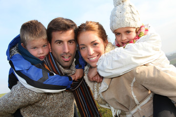 Family of 4 people in countryside