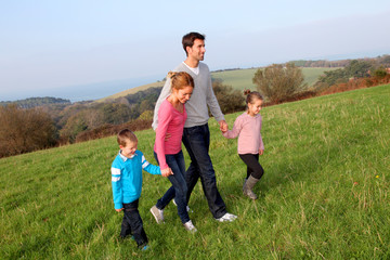Family having a walk in countryside