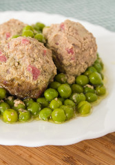Meatballs with peas.