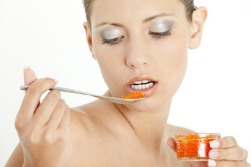portrait of woman with red caviar