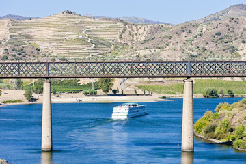 railway viaduct and cruise ship in Pocinho, Douro Valley, Portug