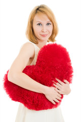 A woman holds a heart in his hands on a white background.