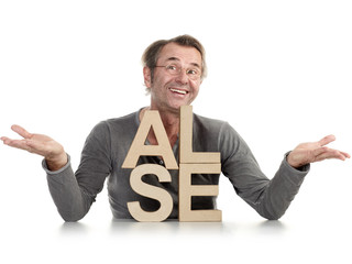 Smiling adult man presenting SALE letters